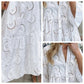Robe en coton brodé à col en V et manches cloche